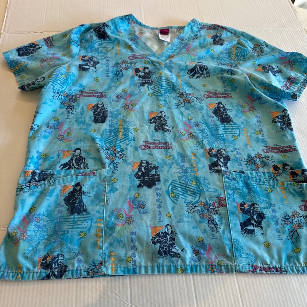 Disney Pirates of the Caribbean Scrub Top Women's Large Blue V-Neck Short Sleeve